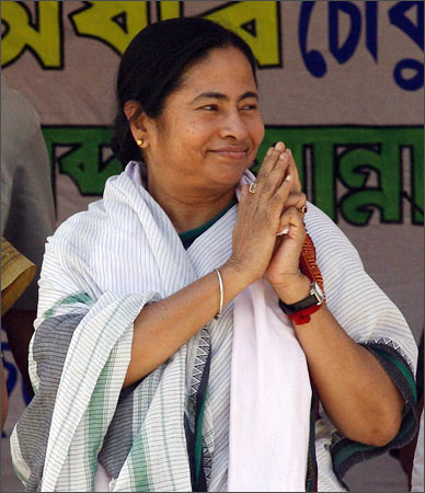 Mamata waves to the crowd at an election rally