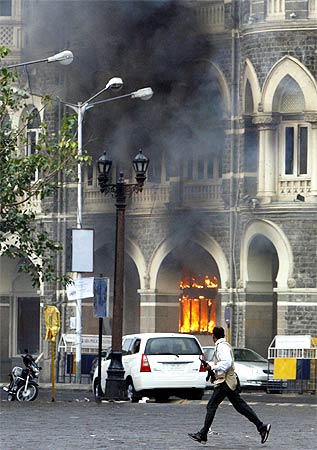 Smoke billows out of Mumbai's Taj Mahal hotel during the siege by terrorists