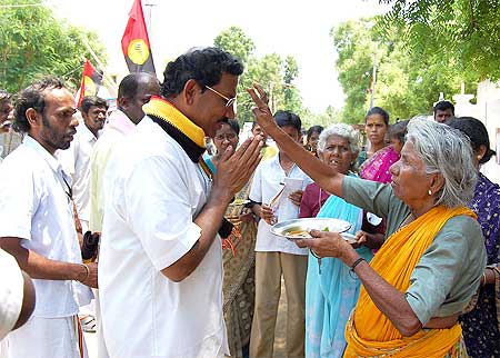 Pandia Rajan is being blessed by an elderly lady during his campaign rally