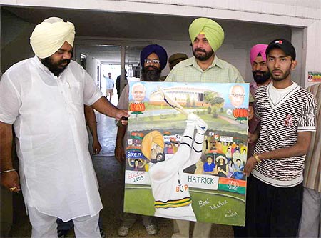 A fan gifts Sidhu a painting
