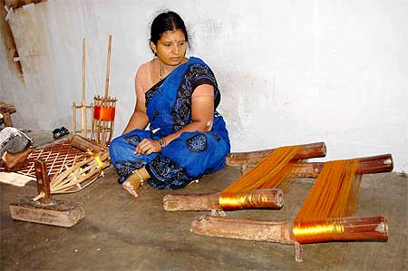 A disenchanted weaver at her home