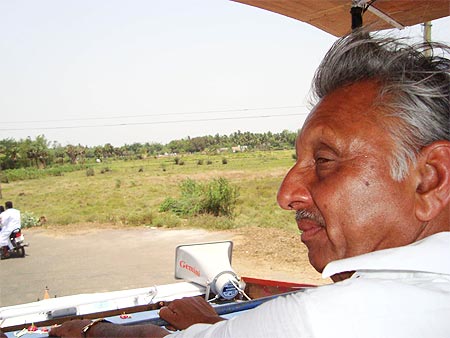 Congress candidate from Mayiladuthurai Mani Shankar Aiyar surveys his constituency from atop his campaign vehicle