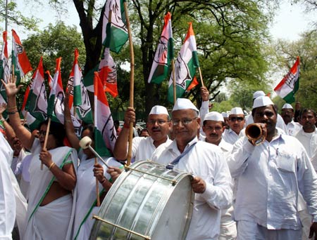 Congress party workers celebrate in New Delhi