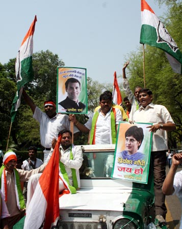 Congress workers participate in a victory rally