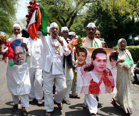 Congress workers celebrate outside Congress headquarters in New Delhi