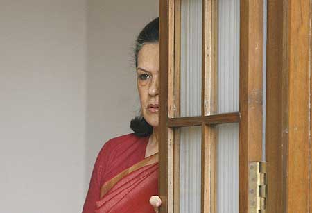 Congress president Sonia Gandhi awaits Prime Minister Manmohan Singh at her home soon after the election results were known on May 16