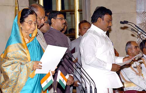 President Pratibha Patil administering the oath as Cabinet minister to A Raja