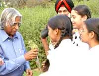 President Kalam takes school children on a tour of his herbal garden
