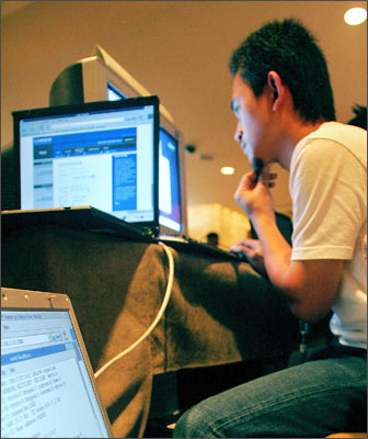 Malaysians participate in computer attack and defence hacking competition during the 3rd annual Hack-In-The-Box Security Conference 2004 in Kuala Lumpur