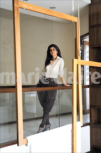 Fashion designer Kiran Uttam Ghosh strikes a pose in her home