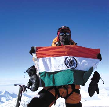Malli Mastan Babu with the Indian flag on top of Mt Vinson Massif, Antarctica's tallest peak