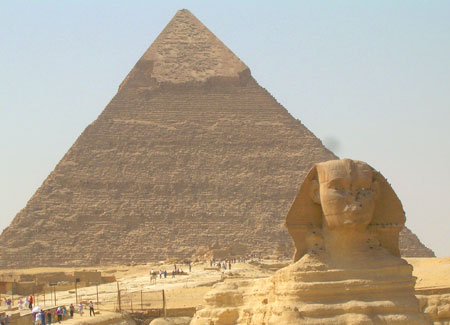 The Sphinx with the pyramids as a backdrop.