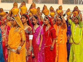 Young Rajasthani girls dressed in vibrant colours with pots on their heads made for a special attraction at the inaugural parade.