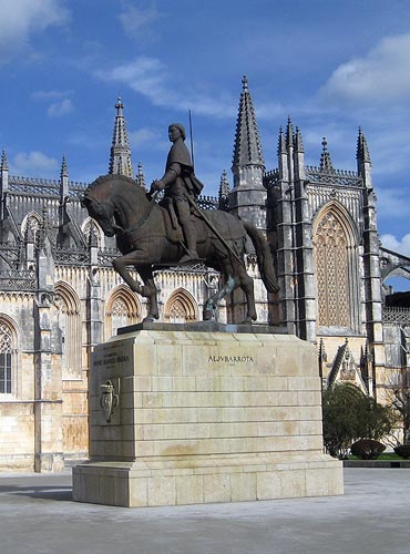 Statue of Nuno Pareira against the backdrop of Batalha Abbey
