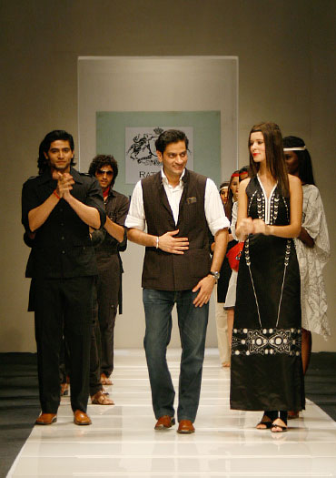 Designer Raghavendra Rathore on the runway with his models at a showing in Delhi