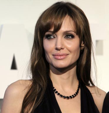 Angelina Jolie wearing the black and rose gold necklace which will be part of her collection