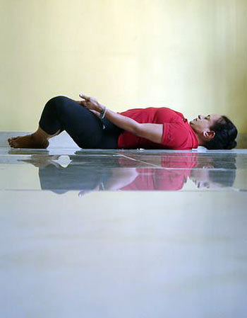 Supta baddhakonasana (Lying bound angle pose)