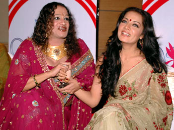 Laxmi Narayan Tripathi and actress Celina Jaitley share a light moment