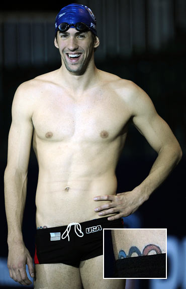 You can just see the Olympic rings peeking from swimming champ Michael Phelps' trunks