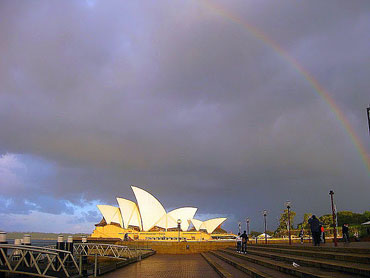 Unusual monsoon pics: Rainbow over Sydney