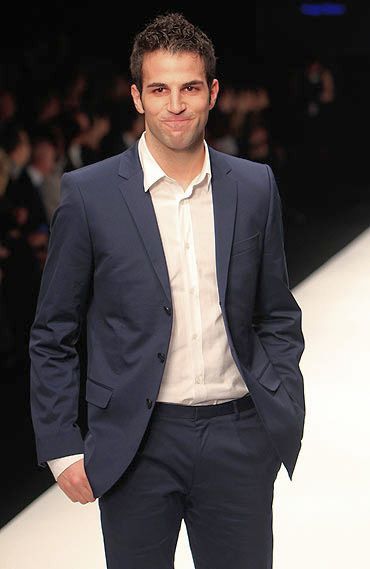Spanish footballer, Cesc Fabregas also walked the runway at the same show, striking a relaxed pose in trousers and a deep blue jacket