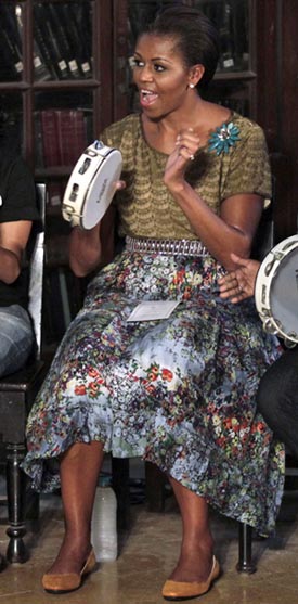 Michelle plays a tambourine with underprivileged kids at Mumbai University, November 6