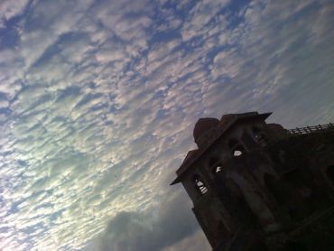 Palace against a cauliflower-clouded sky