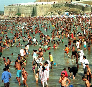 Thousands of Moroccans crowd the Atlantic coast beach in Rabat