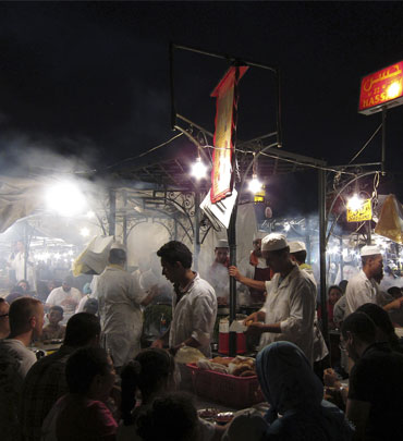 People eat at food stands in Djemaa El Fna square in Marrakesh.