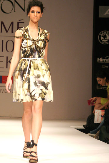 A model showcases a creation from the Vizyon label