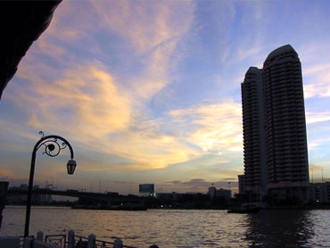 Bangkok from the Chao Phraya River at sunset.