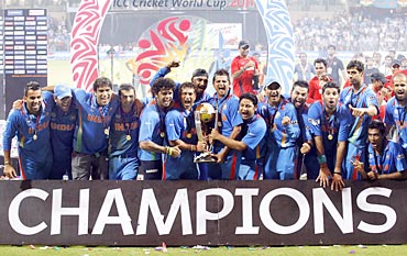 India's players celebrate with their trophy after India won their ICC Cricket World Cup final match against Sri Lanka in Mumbai April 2, 2011.