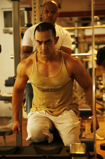 Aamir Khan being trained by a fitness instructor