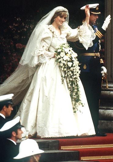The late Princess Diana in her Emanuel gown, seen here with Prince Charles at their 1981 wedding