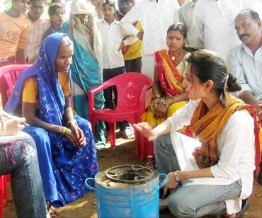 Juneja with villagers at a demonstration