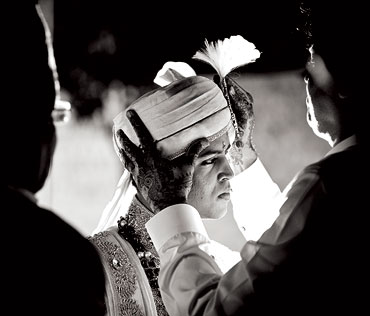 At the Hyderabad International Convention Centre, a groom dresses up for the baraat
