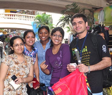 Aayush Thakral poses with his first set of customers