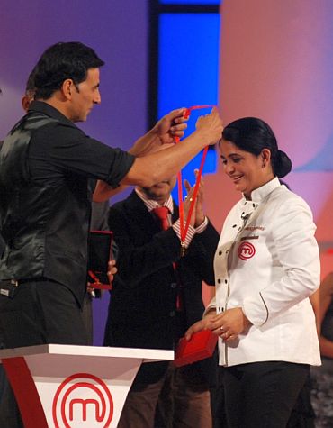 Winner's circle: Akshay Kumar presents Pankaj with her medal