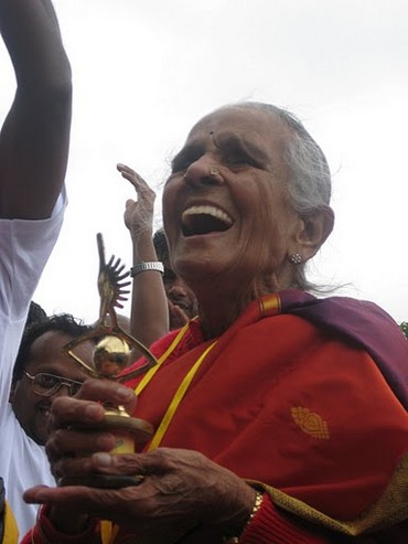 One of the senior participants at the Women Power 5K Run in Bengaluru celebrates at the finish line