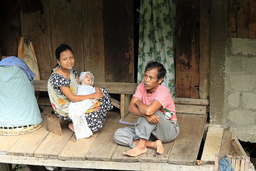 Khasi couple with their new born baby.