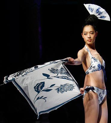 A model presents a creation for the Hosa Swimwear Trend Press Conference at China Fashion Week in Beijing, March 28, 2011