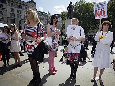 People attend a rally in Trafalgar Square during SlutWalk in London June 11, 2011