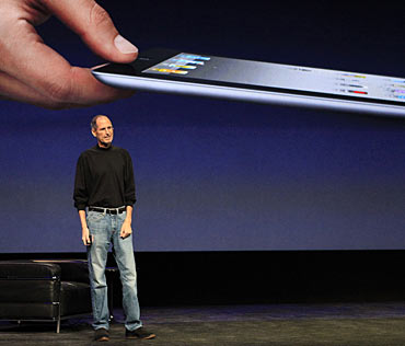 Apple Inc. CEO Steve Jobs introduces the iPad 2 on stage during an Apple event in San Francisco, California March 2, 2011.  Jobs took the stage to a standing ovation on Wednesday, returning to the spotlight after a brief medical absence to unveil the second version of the iPad