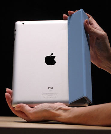 The iPad 2 with a Smart Cover is shown in use in the demonstration area after the iPad 2 launch during an Apple event in San Francisco, California March 2, 2011. Apple unveiled its next generation iPad at an event in San Francisco. Apple CEO Steve Jobs, who is on indefinite medical leave, led the event.