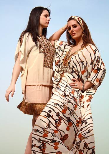 Pria Kataaria Puri (right) poses alongside one of her creations