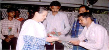 Congress President Sonia Gandhi with workers trained by Pipal Tree