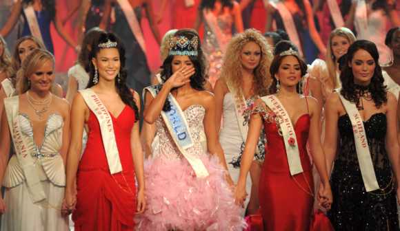 Miss Venezuela, Ivian Sarcos, joins other contestants on stage after being crowned Miss World 2011 in Earls Court in west London