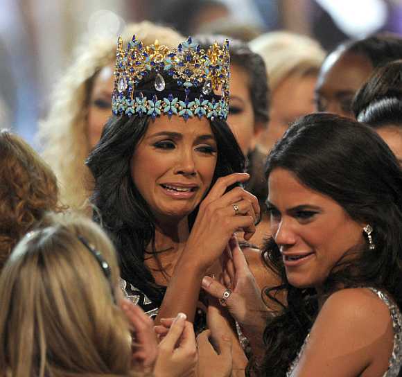 Miss Venezuela, Ivian Sarcos, is congratulated by other contestants after being crowned Miss World 2011 in Earls Court in Earls Court in west London.