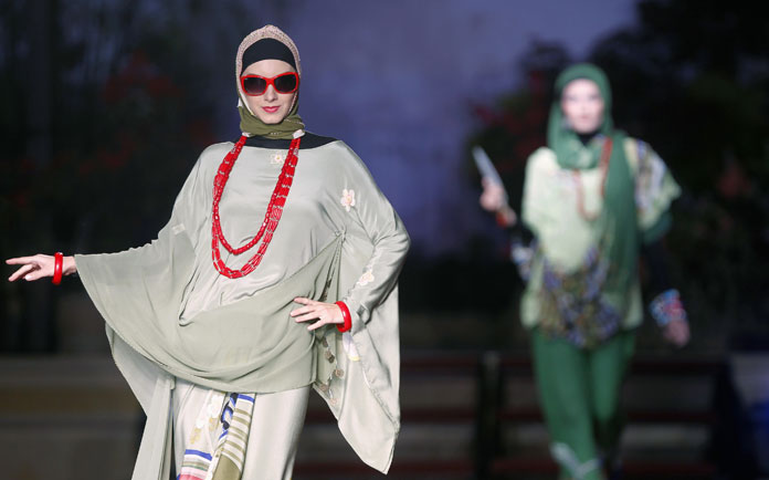 Models present creations from 'The Forbidden City' collection by Zizi Design of Malaysia