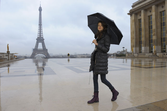 Swiss model Julia Saner walks near the Eiffel tower as she arrives for a fashion show.